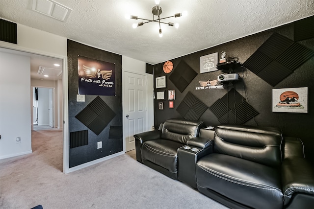 carpeted home theater with a textured ceiling