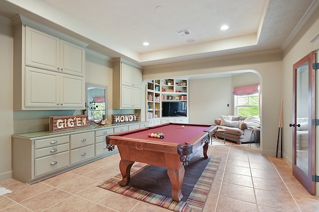 rec room featuring billiards, crown molding, light tile patterned flooring, and a tray ceiling