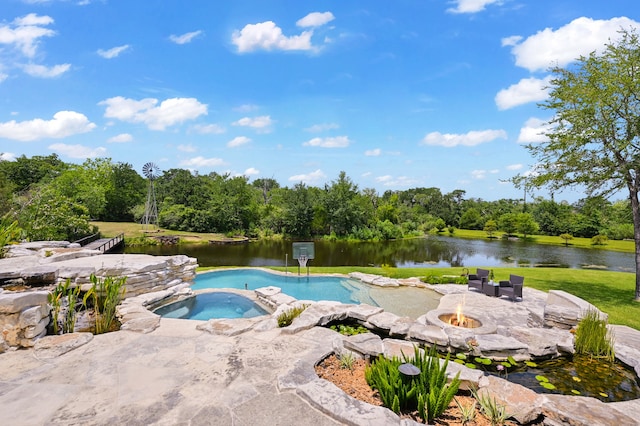 view of swimming pool with a patio, an in ground hot tub, and a water view