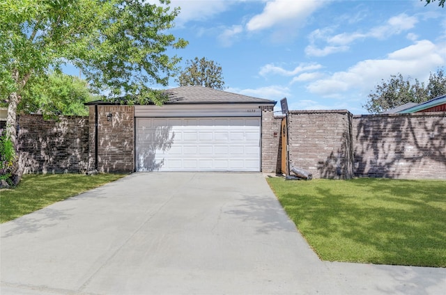 garage with a lawn