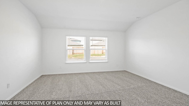 unfurnished room with lofted ceiling and carpet floors