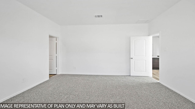 unfurnished room featuring carpet