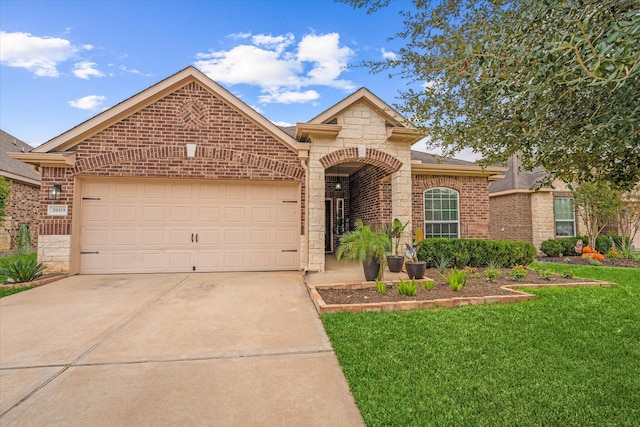 view of front facade with a front yard and a garage