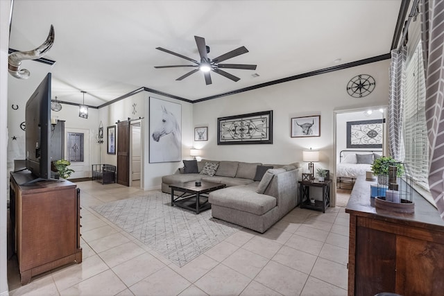 tiled living room featuring crown molding, a barn door, and ceiling fan