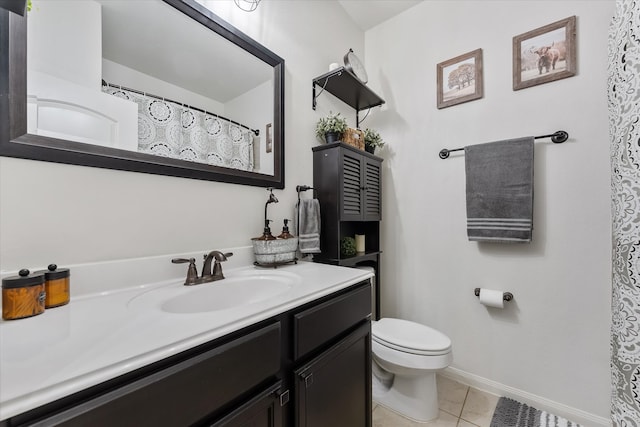 bathroom featuring vanity, toilet, and tile patterned flooring