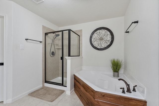 bathroom with shower with separate bathtub and tile patterned floors