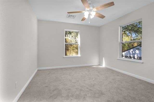 unfurnished room featuring carpet and ceiling fan