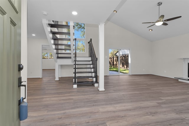 interior space featuring high vaulted ceiling, wood-type flooring, and ceiling fan