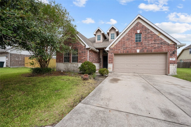 front of property featuring a front yard and a garage