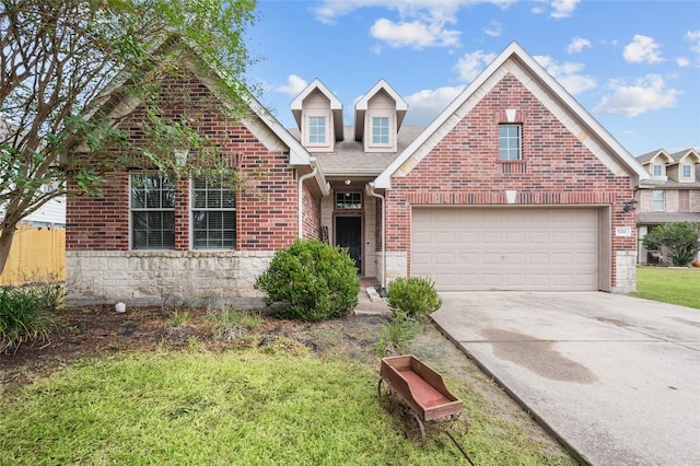 view of property with a front yard and a garage