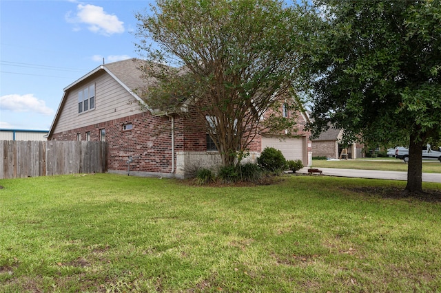 view of side of property with a lawn