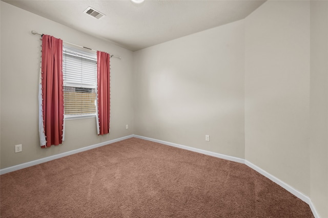 unfurnished room featuring carpet