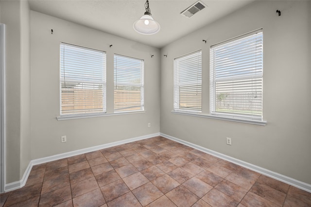 tiled empty room with plenty of natural light