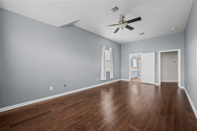 unfurnished bedroom with dark hardwood / wood-style floors, ensuite bath, and ceiling fan