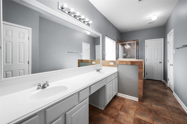 bathroom with vanity and walk in shower