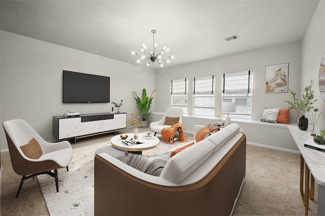 living room with light colored carpet and an inviting chandelier