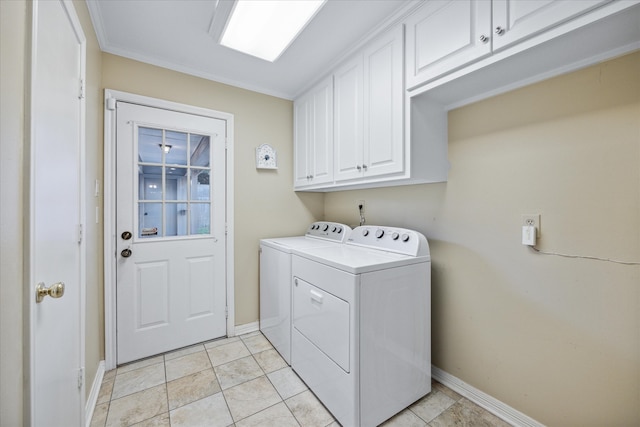 washroom with ornamental molding, light tile patterned floors, separate washer and dryer, and cabinets