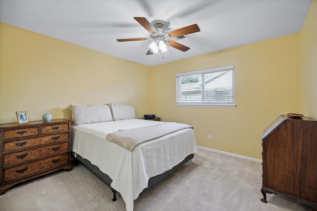 bedroom featuring ceiling fan and light colored carpet