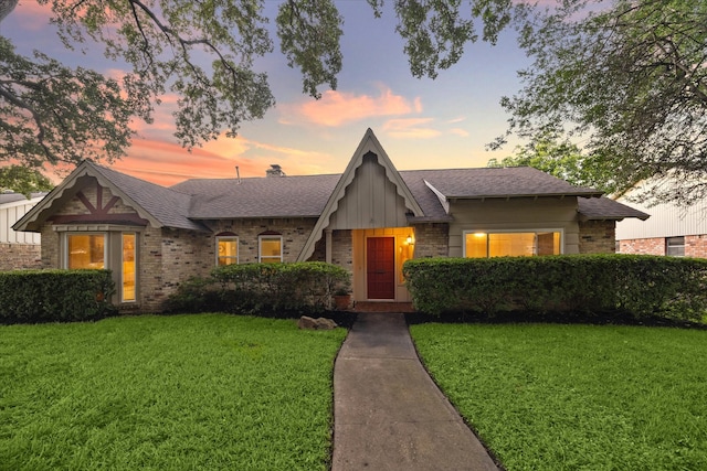 view of front of house with a yard