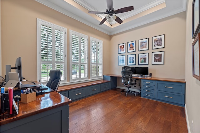 office featuring built in desk, crown molding, dark hardwood / wood-style floors, and ceiling fan