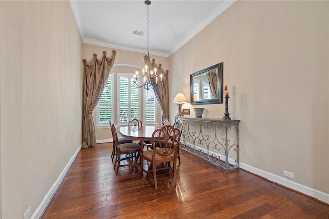 dining space featuring ornamental molding, a chandelier, and dark hardwood / wood-style floors