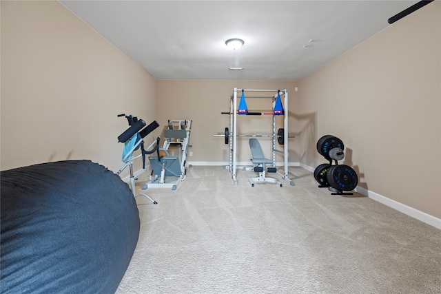 workout room with light colored carpet