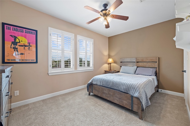 bedroom featuring light colored carpet and ceiling fan