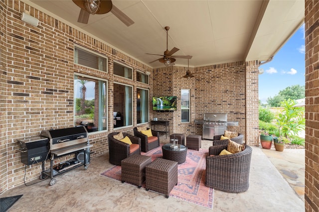 view of patio with area for grilling, ceiling fan, and a grill