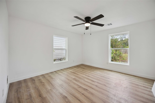 spare room with light hardwood / wood-style flooring and ceiling fan