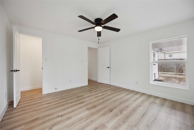 unfurnished bedroom featuring light hardwood / wood-style flooring and ceiling fan