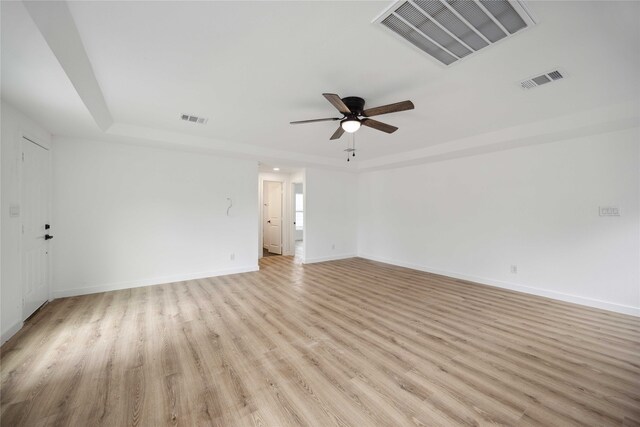 unfurnished room with light wood-type flooring and ceiling fan