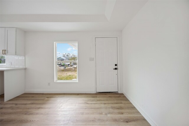 unfurnished dining area featuring light hardwood / wood-style floors