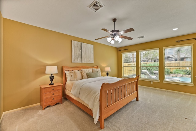 bedroom featuring ceiling fan and light colored carpet