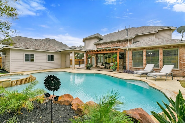 view of swimming pool featuring a pergola, an in ground hot tub, and a patio