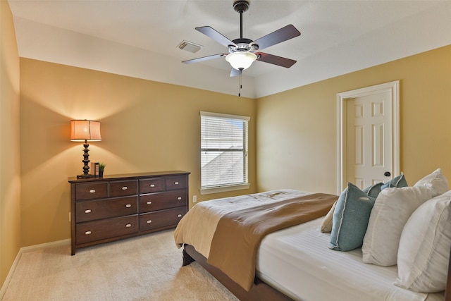 bedroom featuring light colored carpet and ceiling fan