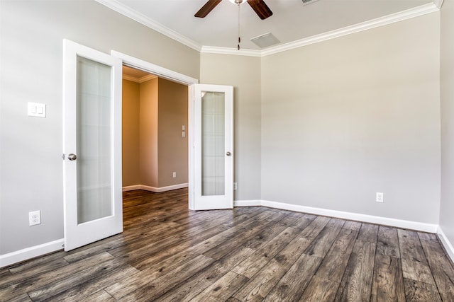 empty room with ceiling fan, french doors, dark hardwood / wood-style floors, and crown molding