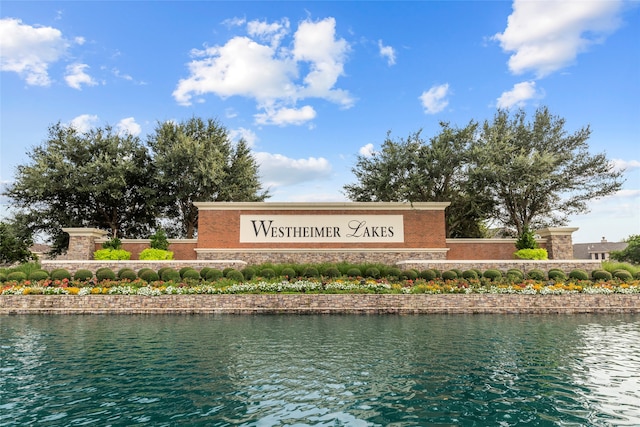 community sign with a water view