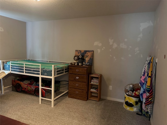 carpeted bedroom with a textured ceiling