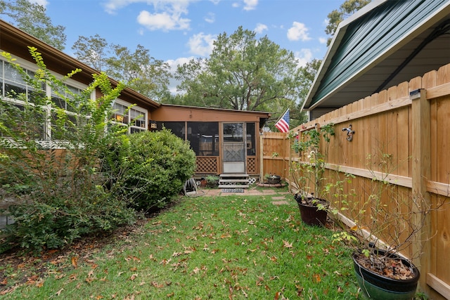 view of yard with a sunroom