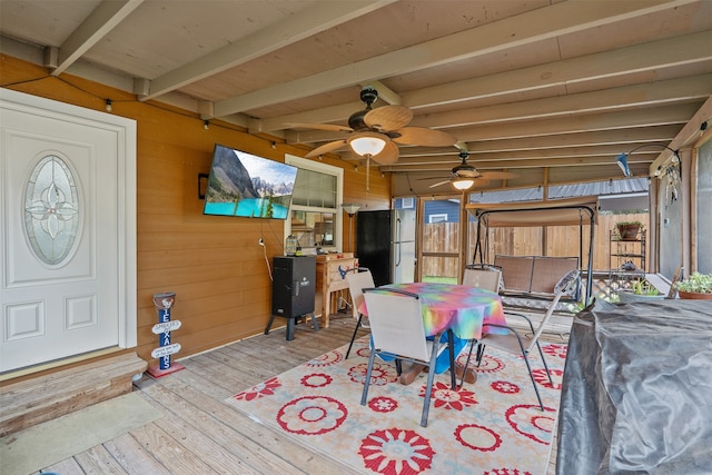 interior space with beamed ceiling and ceiling fan