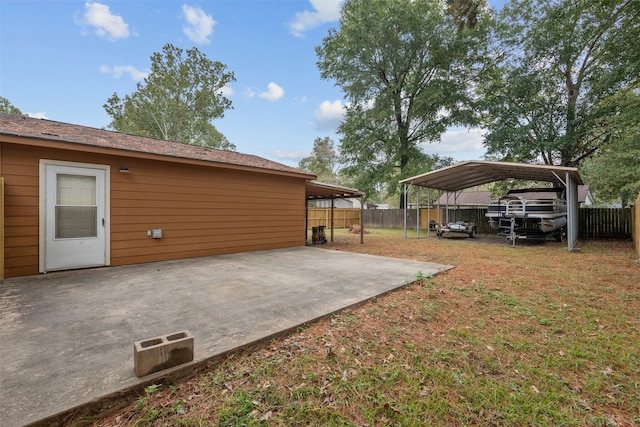 view of yard featuring a patio and a carport