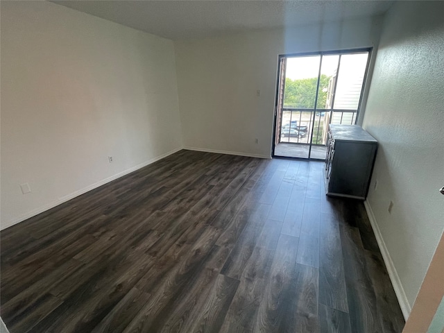 empty room featuring dark hardwood / wood-style floors