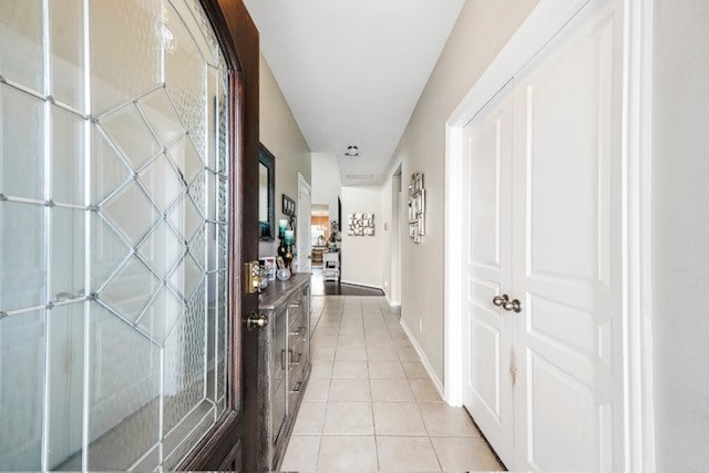 hallway with light tile patterned floors