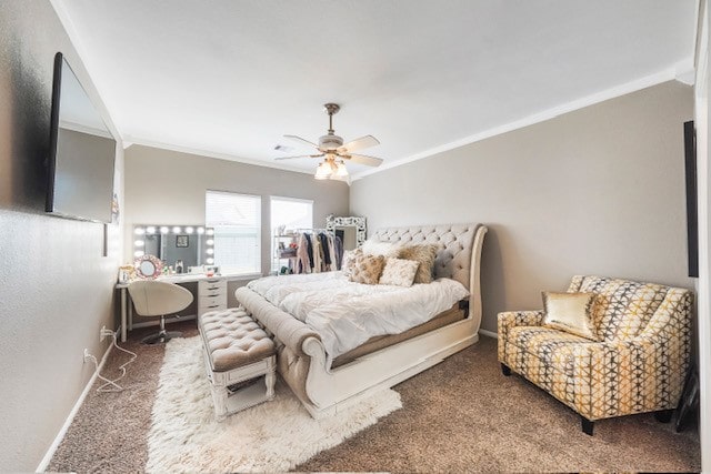 bedroom with crown molding, carpet flooring, and ceiling fan