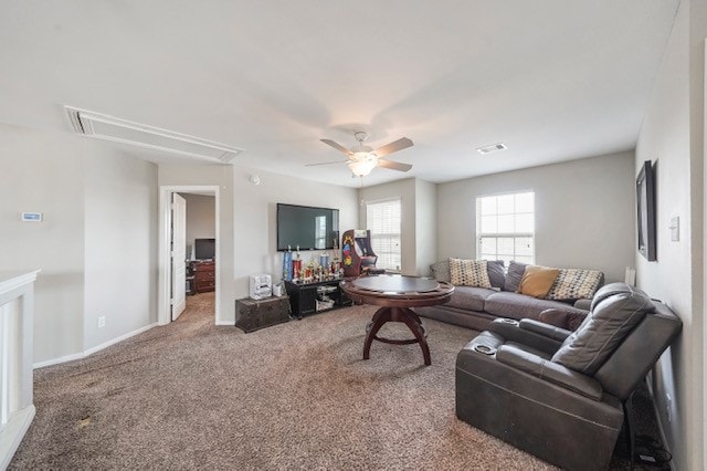 carpeted living room featuring ceiling fan