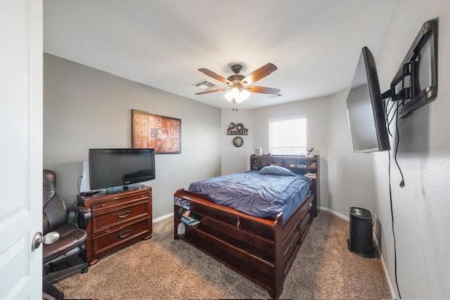 bedroom featuring dark carpet and ceiling fan