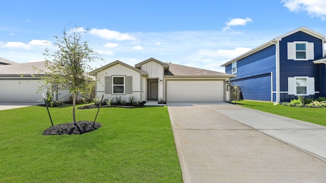 view of front of house featuring a front yard and a garage