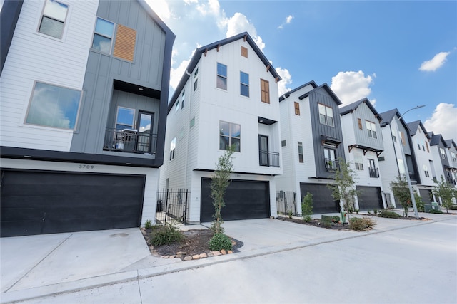 view of front of house featuring a balcony and a garage