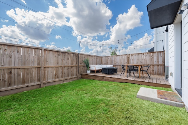 view of yard featuring outdoor lounge area and a wooden deck