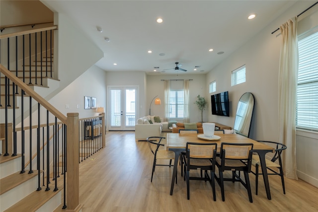 dining space featuring french doors, light hardwood / wood-style floors, and ceiling fan